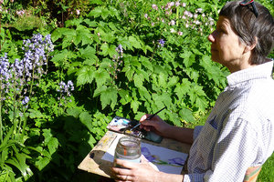 Christine Forbes painting in the garden