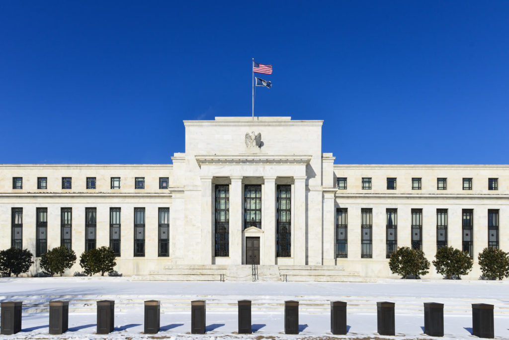 Image depicting the Federal Reserve building with snow covering the surrounding ground