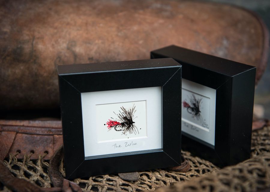 The Zulu fishing fly frame staged on fishing kit